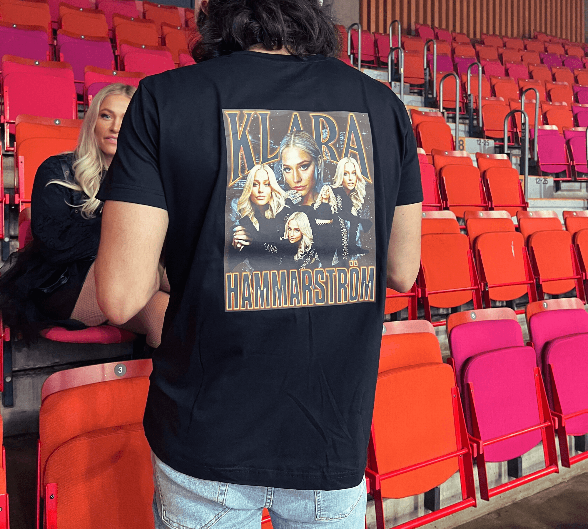 Woman Showcasing Klara Hammarström's "Run to the Hills" Merch Backstage